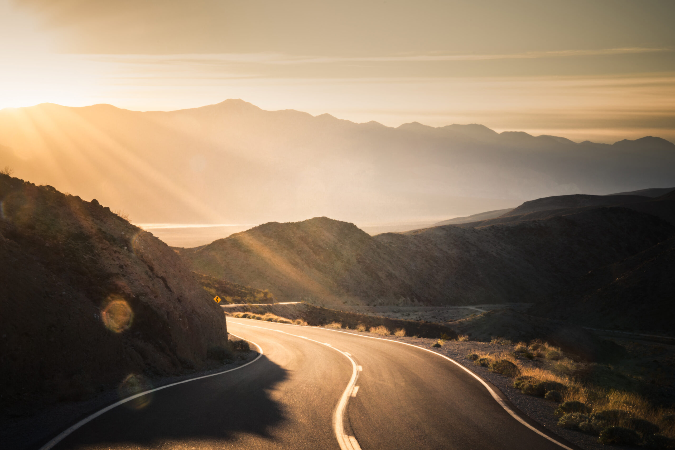 Highway at sunrise, going into Death Valley National Park